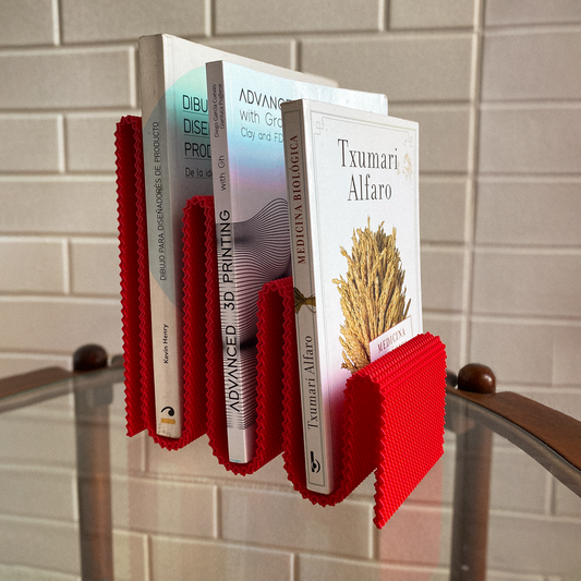 Coregrid Sinu Stand in Red holding books upright – RippleMesh book organiser by Lunfardo