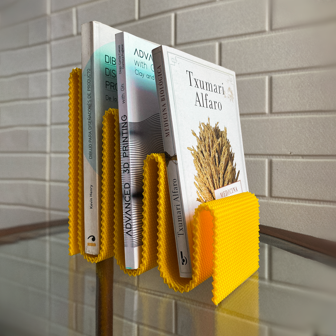 Coregrid Sinu Stand in Yellow holding books upright – RippleMesh book organiser by Lunfardo
