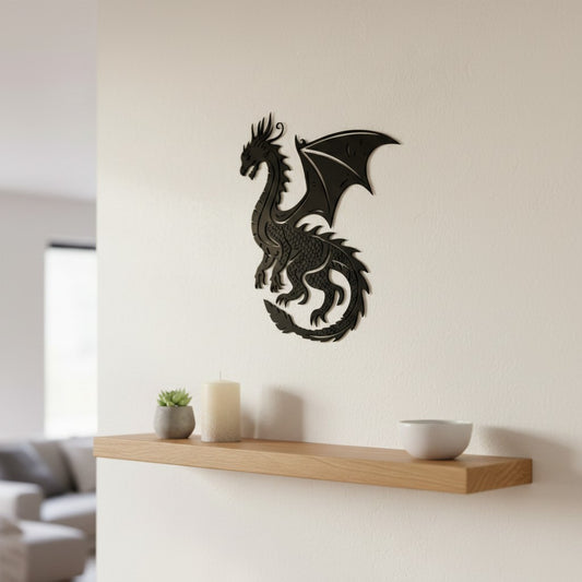 Black 3D printed dragon wall art with detailed scales and wings, mounted on a sage green wall in an eclectic teenager's bedroom, surrounded by framed prints and hanging plants with colourful cushions below, UK made