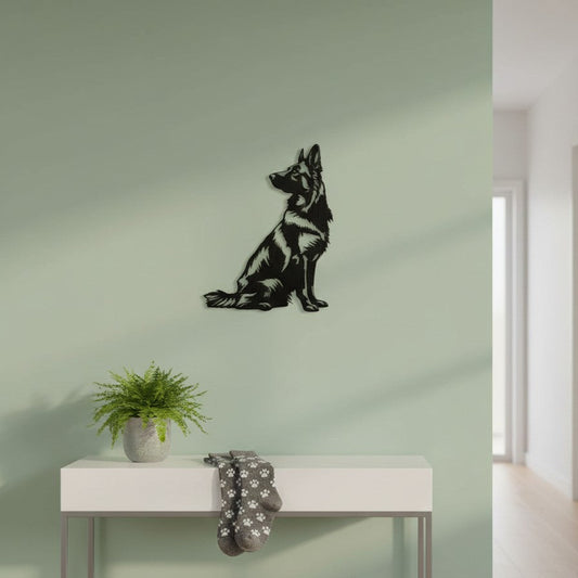 Black 3D printed German Shepherd wall art mounted on a sage green wall in a modern hallway, above a white console table with a potted fern and paw print socks, UK made