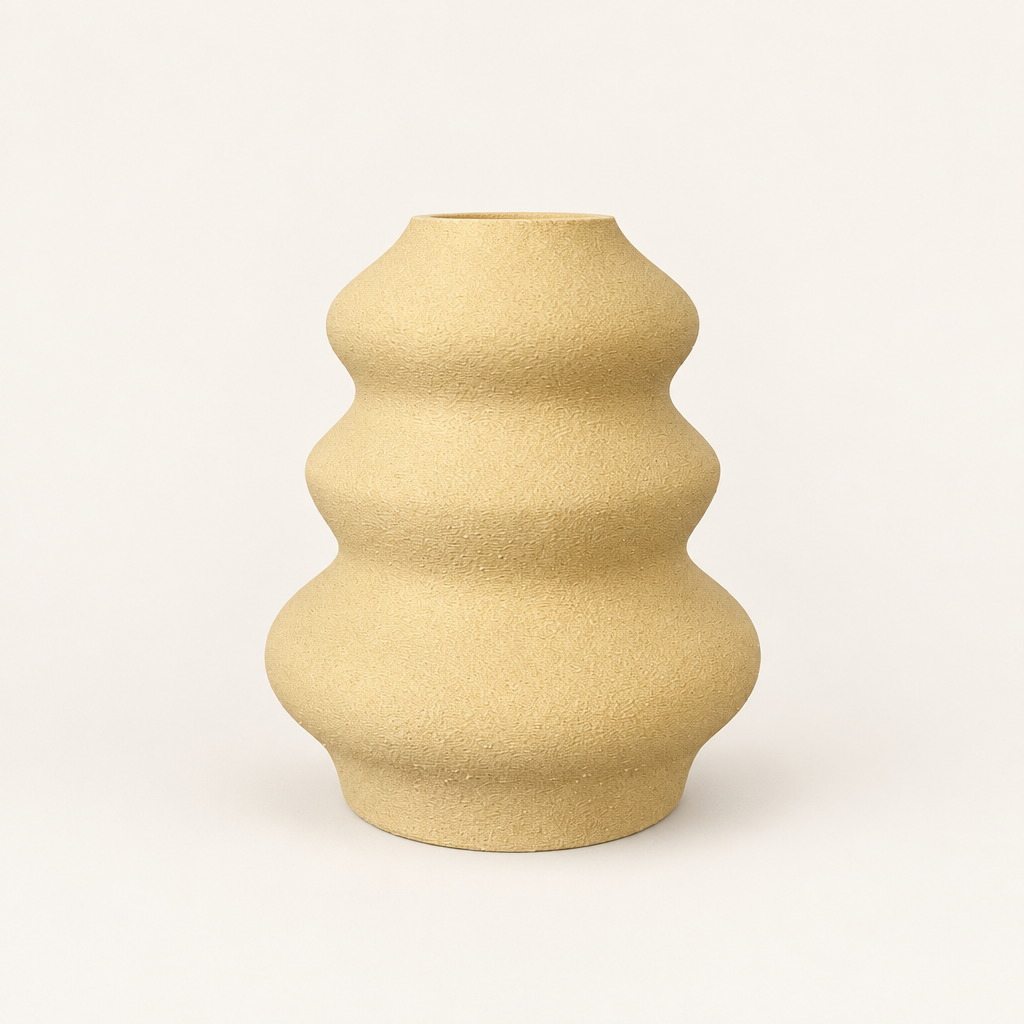 Round tiered sculptural vase on a warm neutral studio background